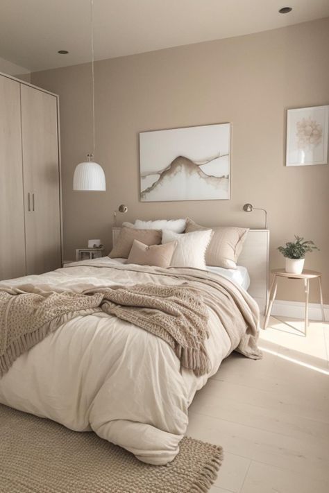 Luxury bedroom layered with beige walls, cream bedding, camel accents, and textured fabrics.