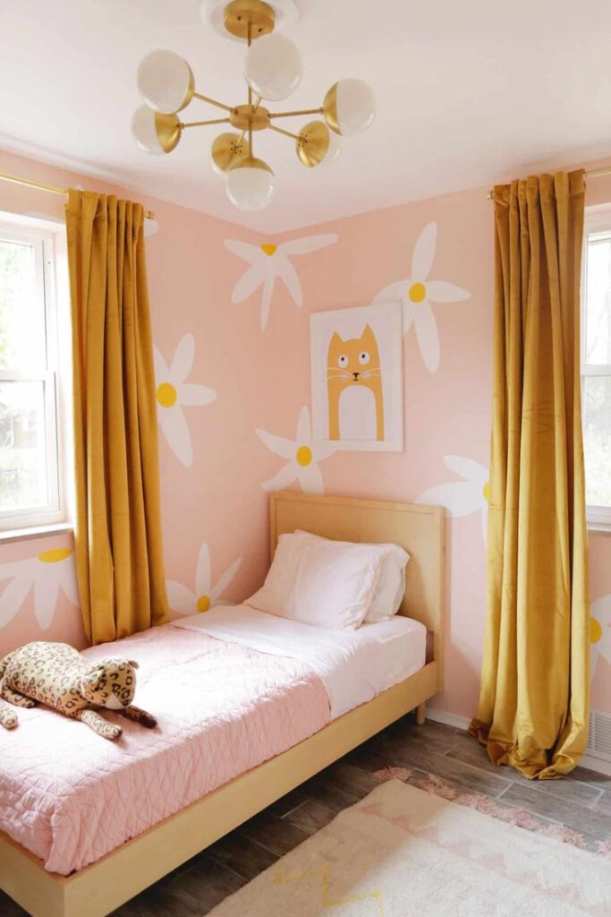 Apartment bedroom featuring peel-and-stick wallpaper behind the bed as a stylish accent wall.