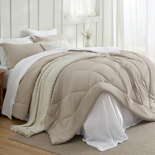 Luxury hotel-style bed with crisp white bedding and layered pillows in a small bedroom.