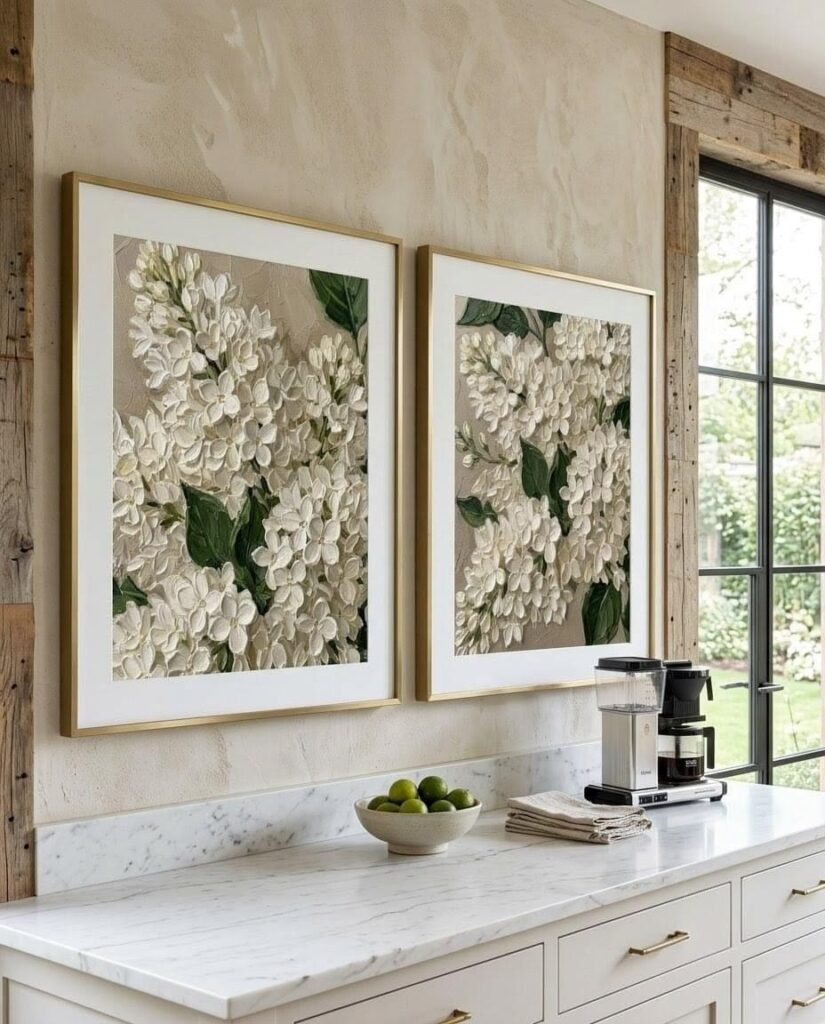 Luxury kitchen with framed botanical artwork complementing modern neutral décor.